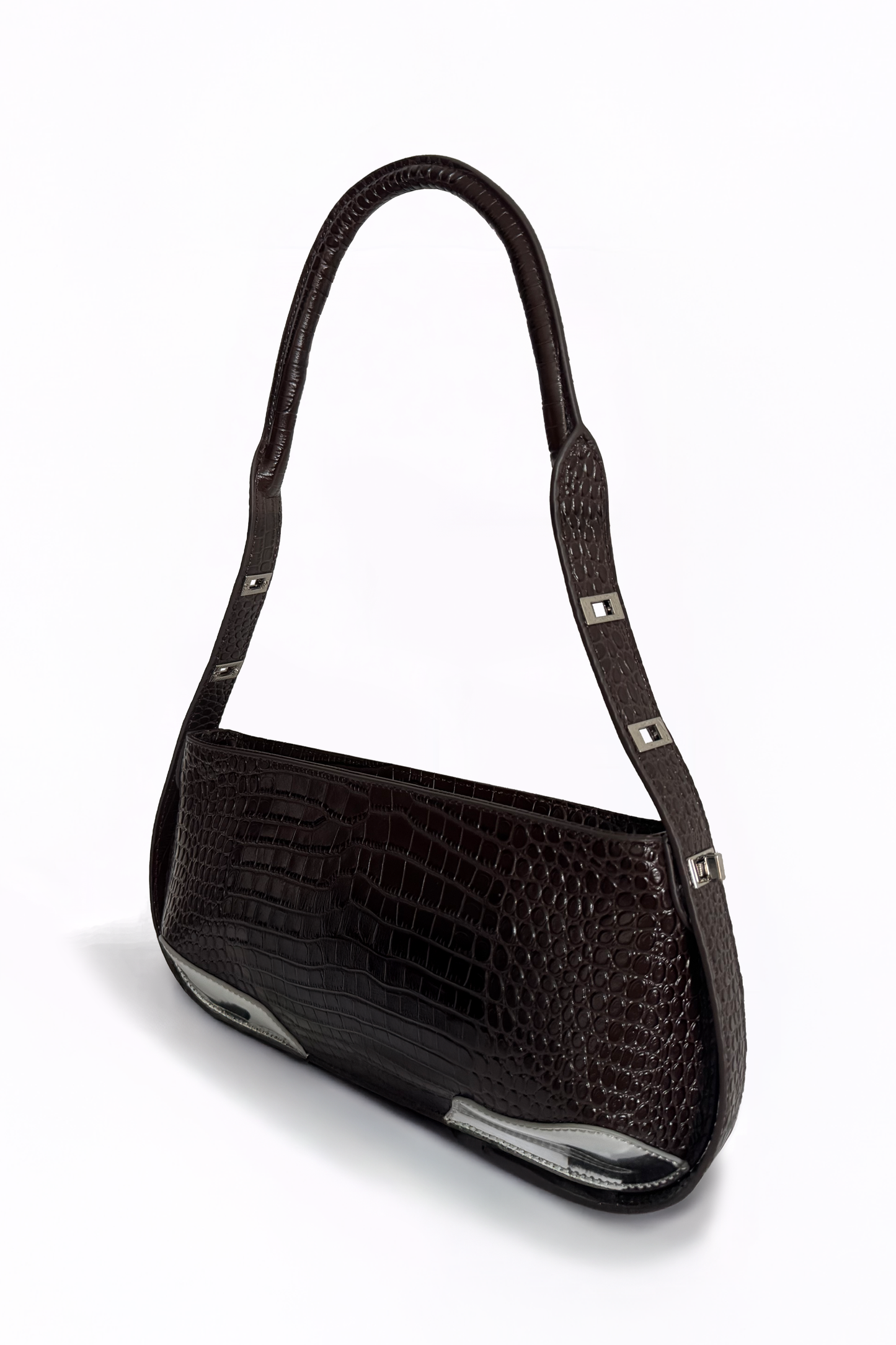 Defined by its rigid, linear elegance, The Avenue Bag by AYZAHD in Sable Ember reimagines modern leatherwork. An architectural masterpiece in croco-embossed calfskin, proudly conceived and designed in Dubai.