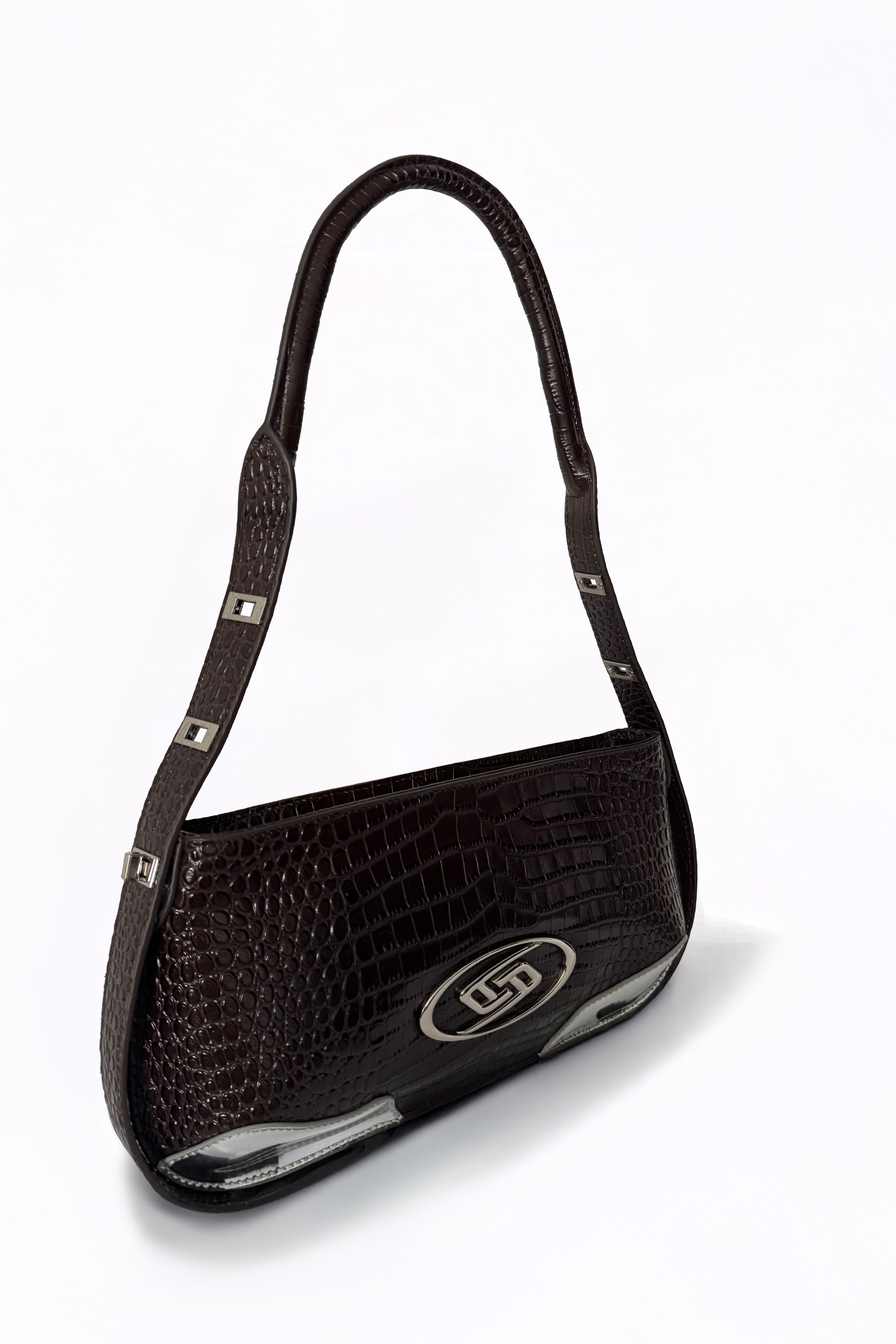The Avenue Bag by AYZAHD captures the warm, deep undertones of Sable Ember on its rich croco-embossed calfskin. A sculptural silhouette designed in Dubai with quiet, uncompromising intention.