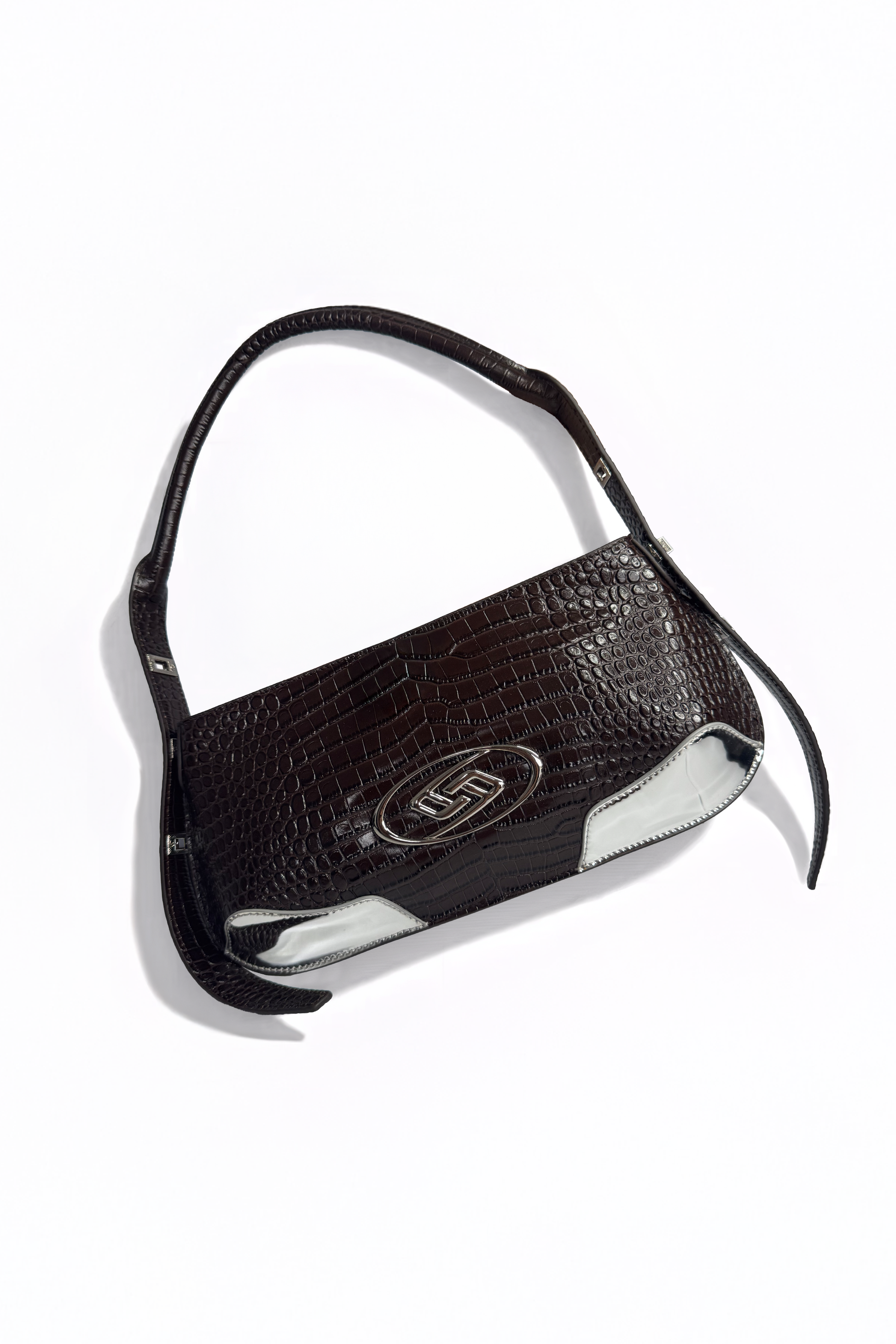 The Avenue Bag by AYZAHD in Sable Ember. Bringing raw luxury, earth-toned warmth, and sharp, geometric forms to the contemporary wardrobe. Crafted from premium croco-embossed calfskin and designed in Dubai.