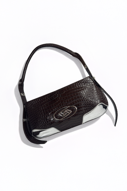 The Avenue Bag by AYZAHD in Sable Ember. Bringing raw luxury, earth-toned warmth, and sharp, geometric forms to the contemporary wardrobe. Crafted from premium croco-embossed calfskin and designed in Dubai.