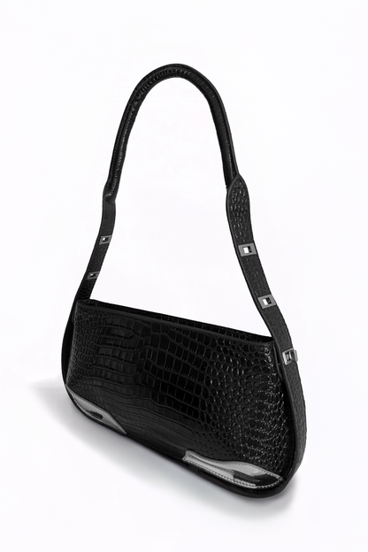 Defined by its rigid, linear elegance, The Avenue Bag by AYZAHD reimagines modern leatherwork. An architectural masterpiece in croco-embossed calfskin, proudly conceived and designed in Dubai.