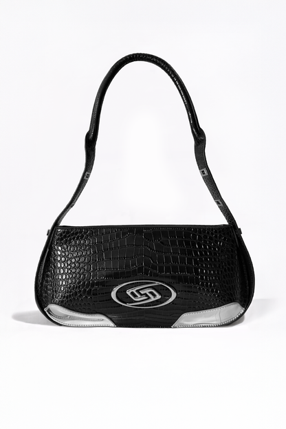The Avenue Bag by AYZAHD. A masterclass in structural discipline, combining a sharp, futuristic silhouette with the rich texture of croco-embossed calfskin. Designed in Dubai for the modern vanguard.