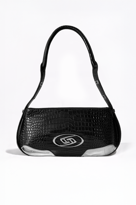The Avenue Bag by AYZAHD. A masterclass in structural discipline, combining a sharp, futuristic silhouette with the rich texture of croco-embossed calfskin. Designed in Dubai for the modern vanguard.