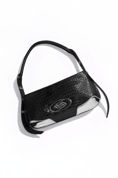 The Avenue Bag by AYZAHD in motion. Bringing raw luxury and sharp, geometric forms to the contemporary wardrobe. Crafted from premium croco-embossed calfskin and designed in Dubai.