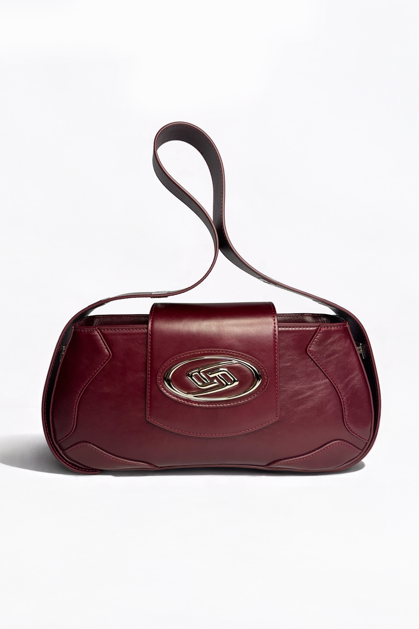 The Downtown Bag by AYZAHD in Emira Rouge. A masterclass in structural discipline, pairing a sharp, futuristic silhouette with the rich texture of rich grained oiled soft calfskin. Designed in Dubai for the modern vanguard.