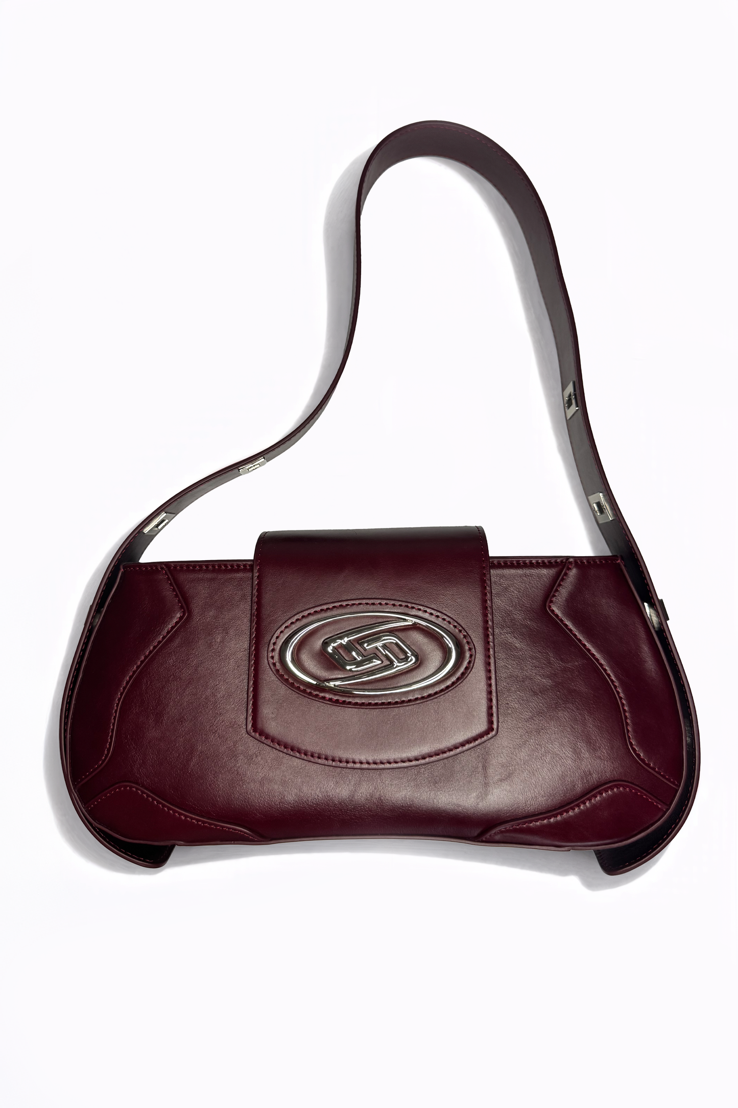 The Downtown Bag by AYZAHD in Emira Rouge. Introducing a radical saturation and sharp, geometric forms to the contemporary wardrobe. Crafted from premium grained oiled soft calfskin and designed in Dubai.