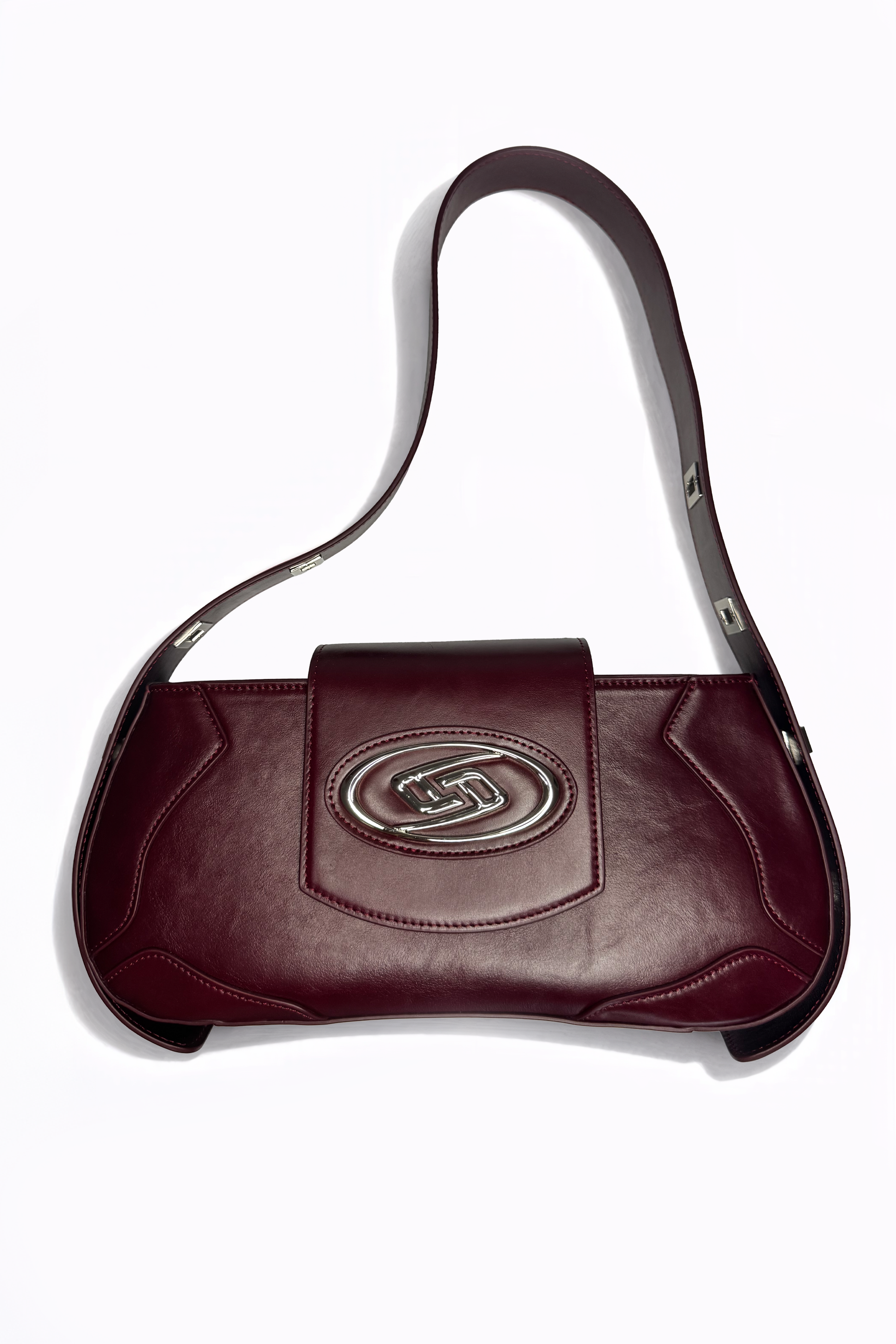 The Downtown Bag by AYZAHD in Emira Rouge. Introducing a radical saturation and sharp, geometric forms to the contemporary wardrobe. Crafted from premium grained oiled soft calfskin and designed in Dubai.