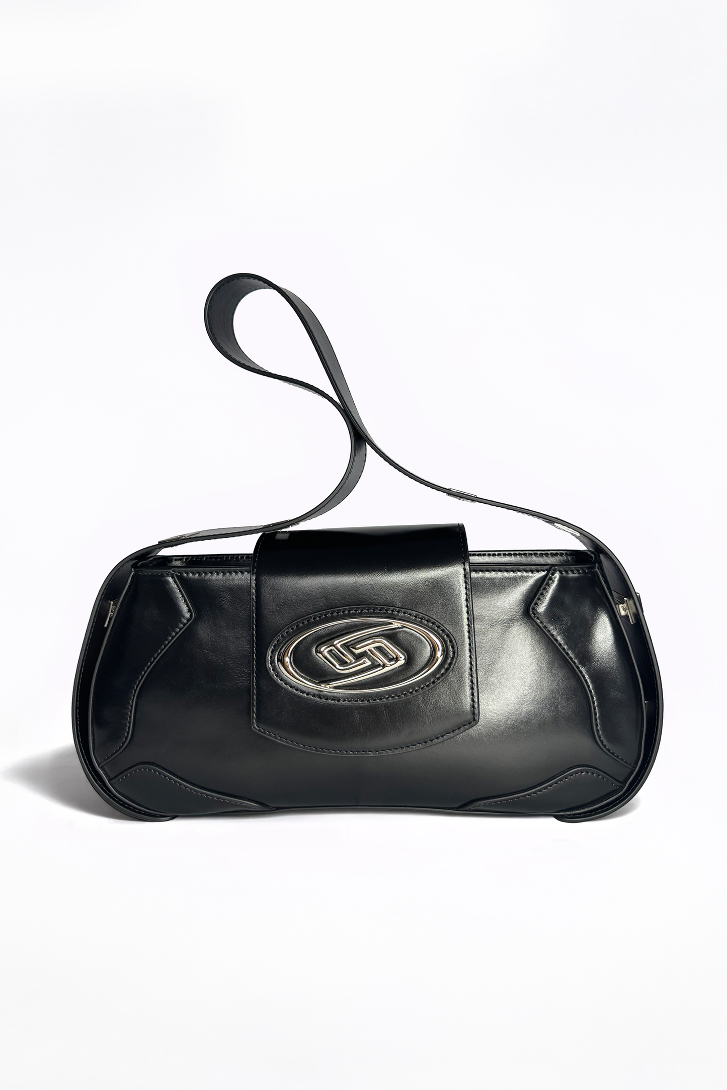 The Downtown Bag by AYZAHD in Obsidian Veil. A masterclass in structural discipline, combining a sharp, futuristic silhouette with the rich texture of grained oiled soft calfskin. Designed in Dubai for the modern vanguard.