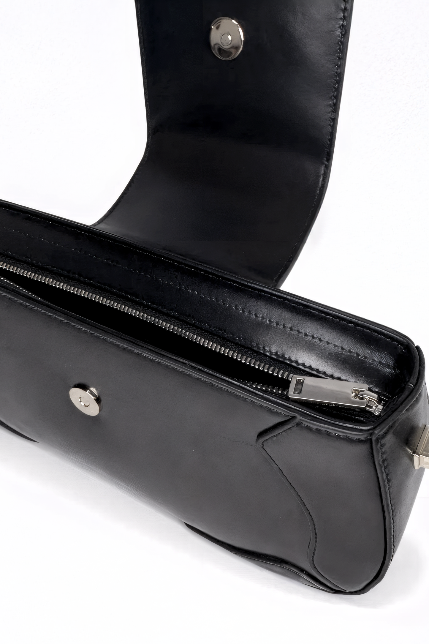 Uncompromising precision in every curve. The Downtown Bag by AYZAHD highlights the striking contrast of futuristic design and the rich, organic texture of Obsidian Veil grained oiled soft calfskin. Designed in Dubai for the avant-garde.
