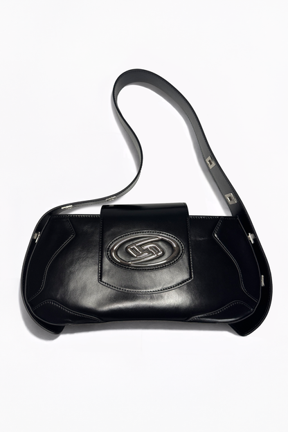 The Downtown Bag by AYZAHD in Obsidian Veil. Bringing raw luxury and sharp, geometric forms to the contemporary urban wardrobe. Crafted from premium grained oiled soft calfskin and designed in Dubai.