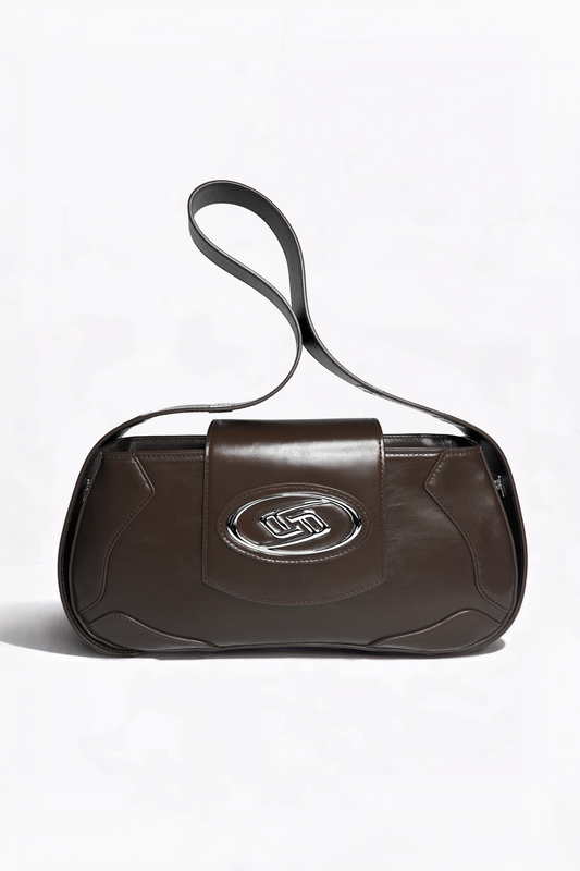 The Downtown Bag by AYZAHD in Ember Brown. A masterclass in structural discipline, pairing a sharp, futuristic silhouette with the rich texture of pigment-rich grained oiled soft calfskin. Designed in Dubai for the modern vanguard.